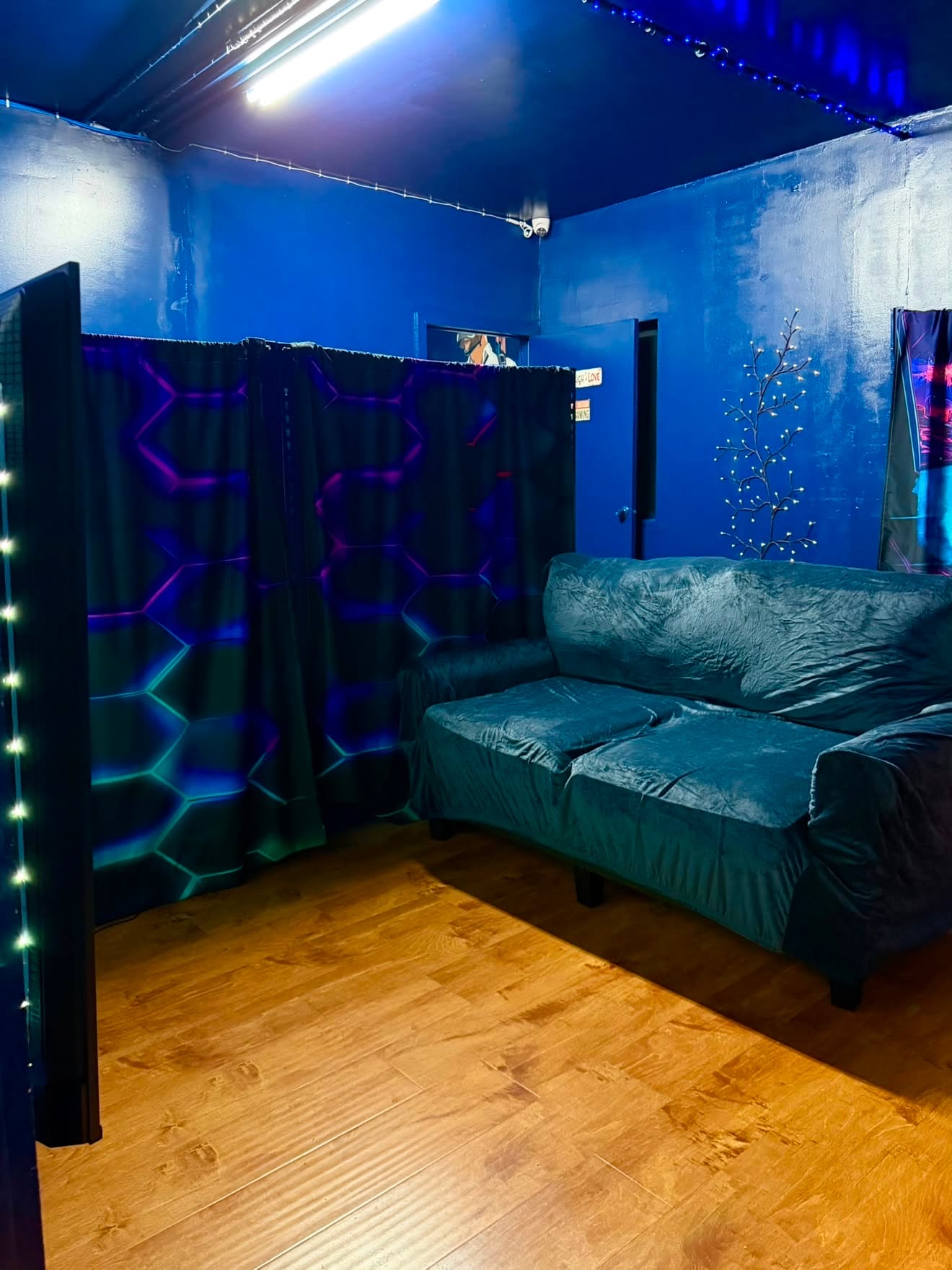 Private console lounge with a deep blue couch