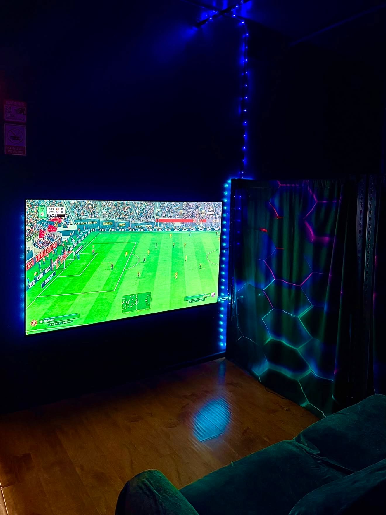 Private PlayStation room with a wall-size screen