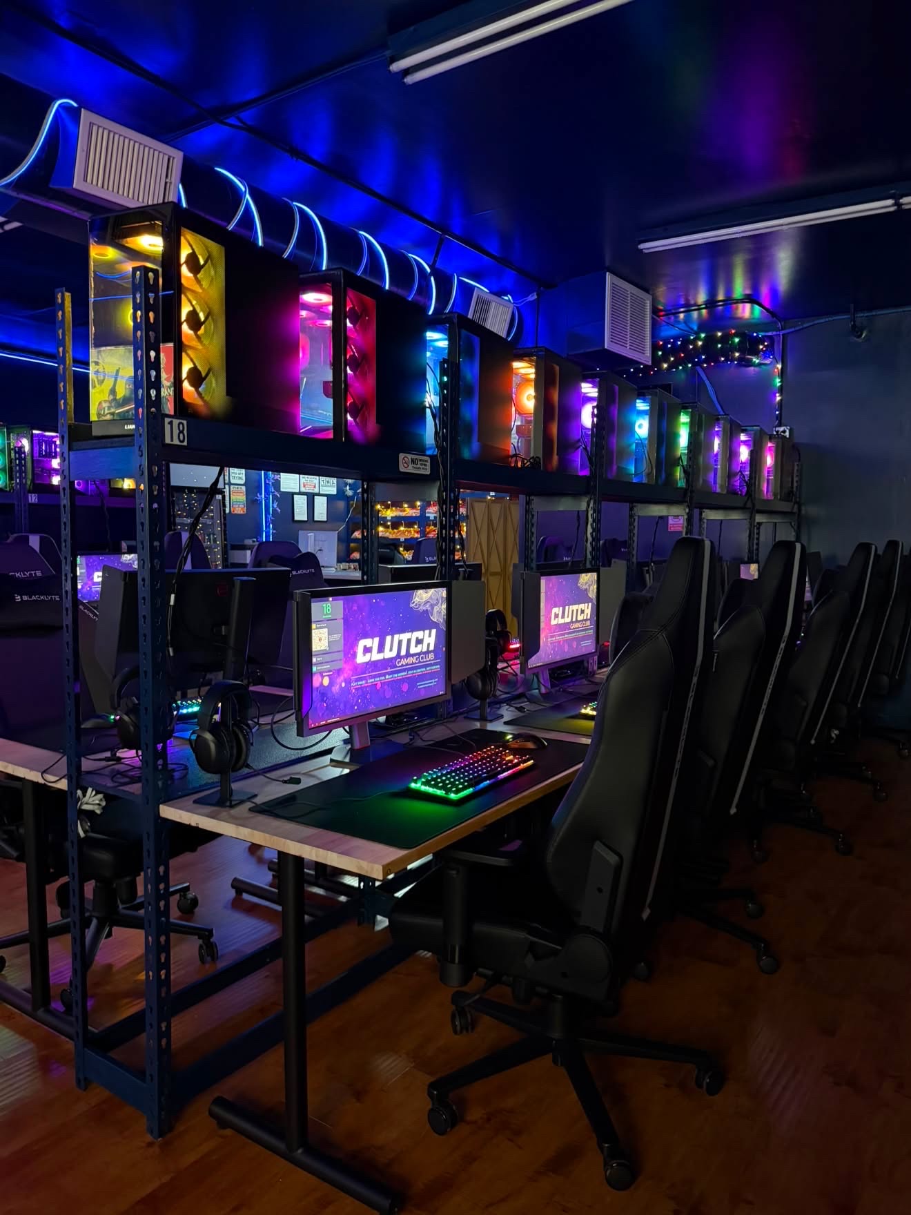 Atmospheric row of RGB gaming computers